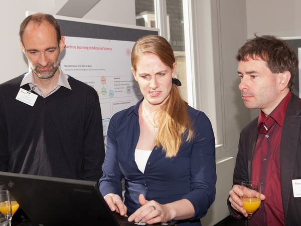 Carsten Lutz, Mareike Picklum, Stefan Bosse (all University of Bremen) discussion during the poster session