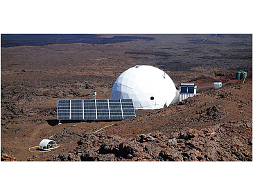 a white big dome and solar panels