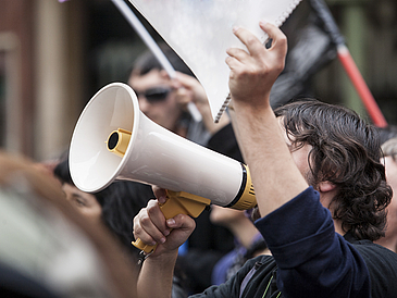 megaphone, demonstrator, protester, young, worker, strike, spain, manifestation, labor reform, cuts, crowd, politics, flags, flags, labor, banners, strike, street, urban, demonstration, protest, people, action, unions, society, unemployed, notebook