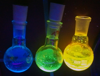 Flasks with fluorescent substances.