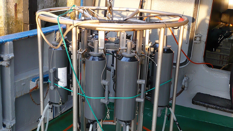 A rosette of Niskin bottles (water sampler) can be used to take numerous water samples at once from clearly defined depths in the ocean. A CTD instrument is incorporated into the rosette that measures salinity, pressure, and temperature at the sample depth.”
