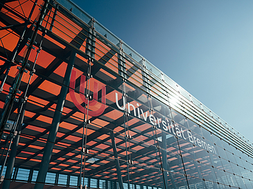 Glass Hall with the university logo