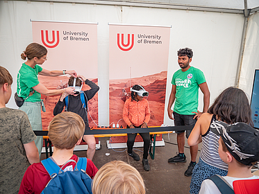 Kids with VR goggles.