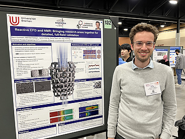 Kevin Kuhlmann in front of his poster on CFD and NMR on the Annal Meeting Catalysis and Reaction Engineering