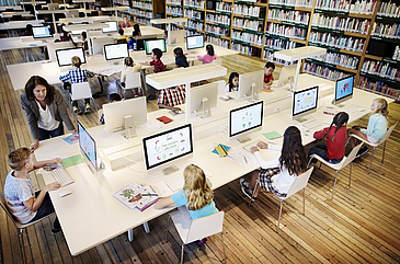 Pupils sitting in front of computers