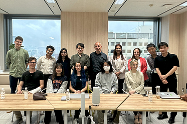 Rainer Malaka and Thomas Eßmeier (back row center and left) with Prof. Isao Echizen and his group