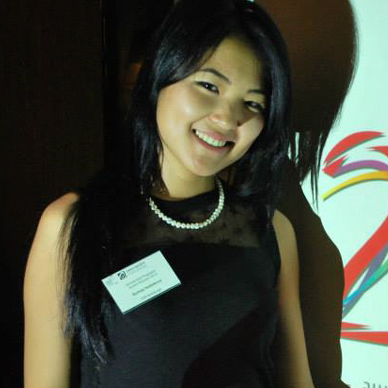 In the photo there is a woman with dark hair.