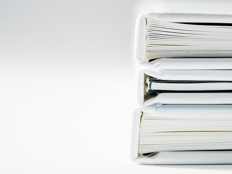 three books on a stack white background