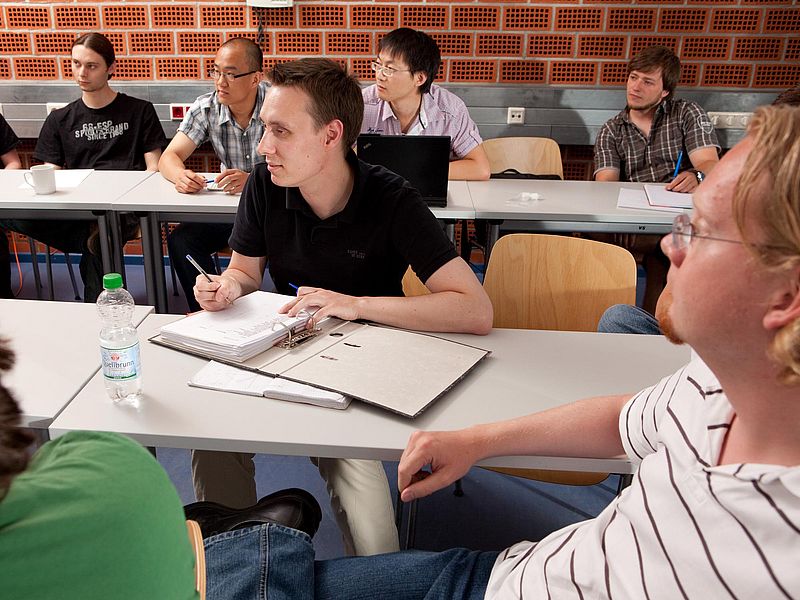 Attentive listeners in a seminar room.