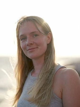 Joely Marie Maak on board a research vessel as the sun sets.