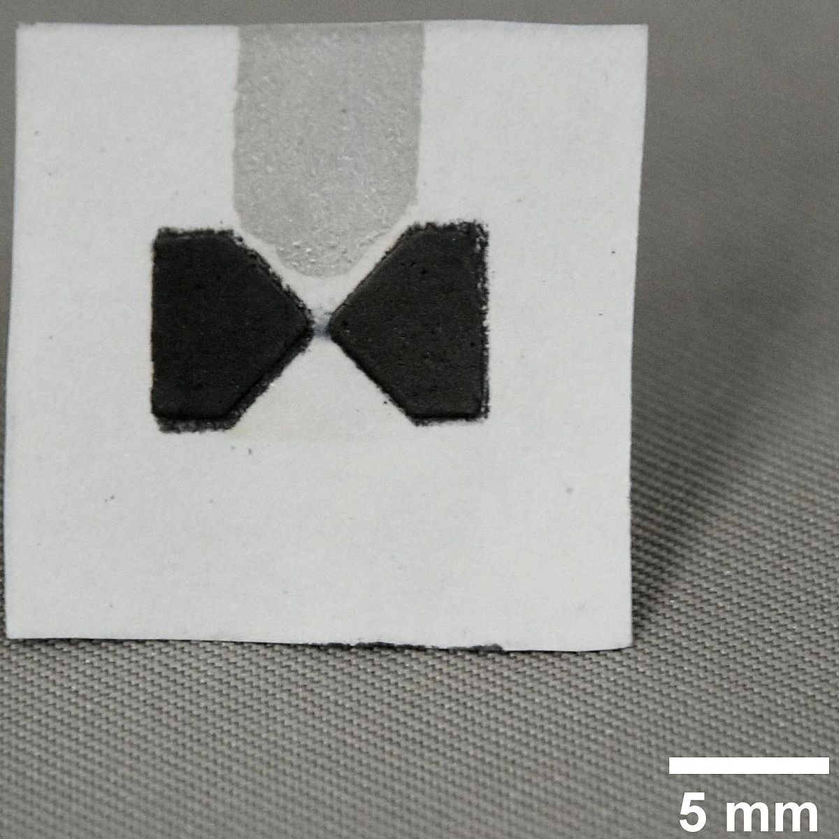 (© SP) Flexible paper OECT with carbon source, drain and silver gate electrode.