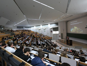 Lecture hall with students and speaker