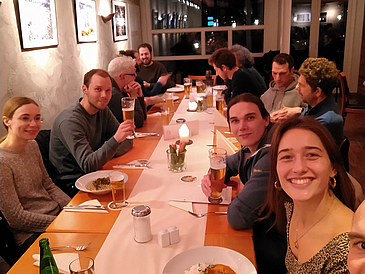 The working group enjoys Grünkohl together at a restaurant