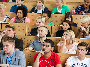 Students sit in the lecture hall.