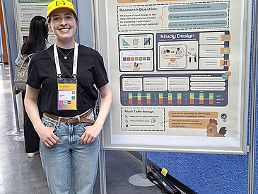 Anika at her poster Anika at her poster