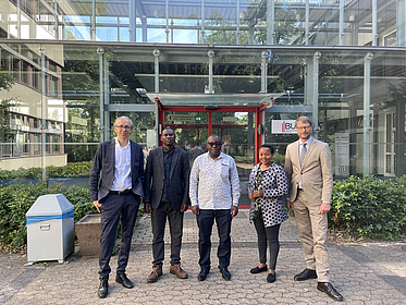 Dean and Professor Buchner with guests from Tanzania
