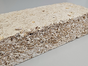 Mycelium-based composite material made of straw, husks, and starch.