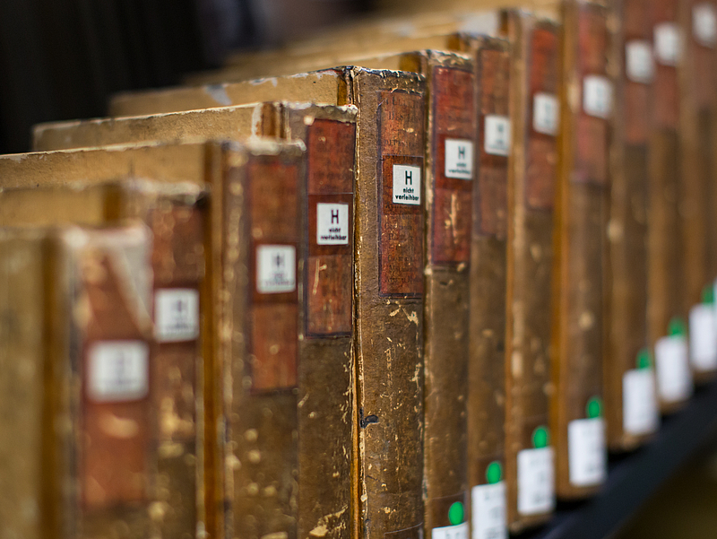 Old books in a shelf.